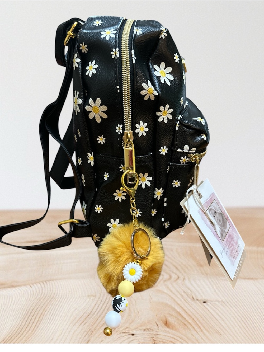 Jessica Simpson Black Daisy Mini Backpack with Gold Hardware and 2 Charms.
NWT - Picture 2 of 4